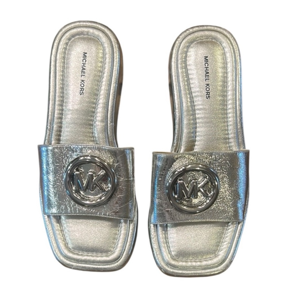 I’M LOOKING FOR THIS SHOE IN SIZE 8 
Michael Kors Metallic Silver Slide Sandals